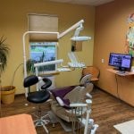 Inside a dental exam room at {PRACTICE_NAME}