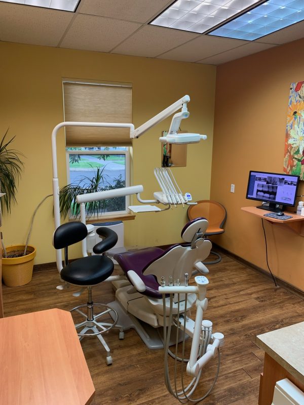 Inside a dental exam room at {PRACTICE_NAME}